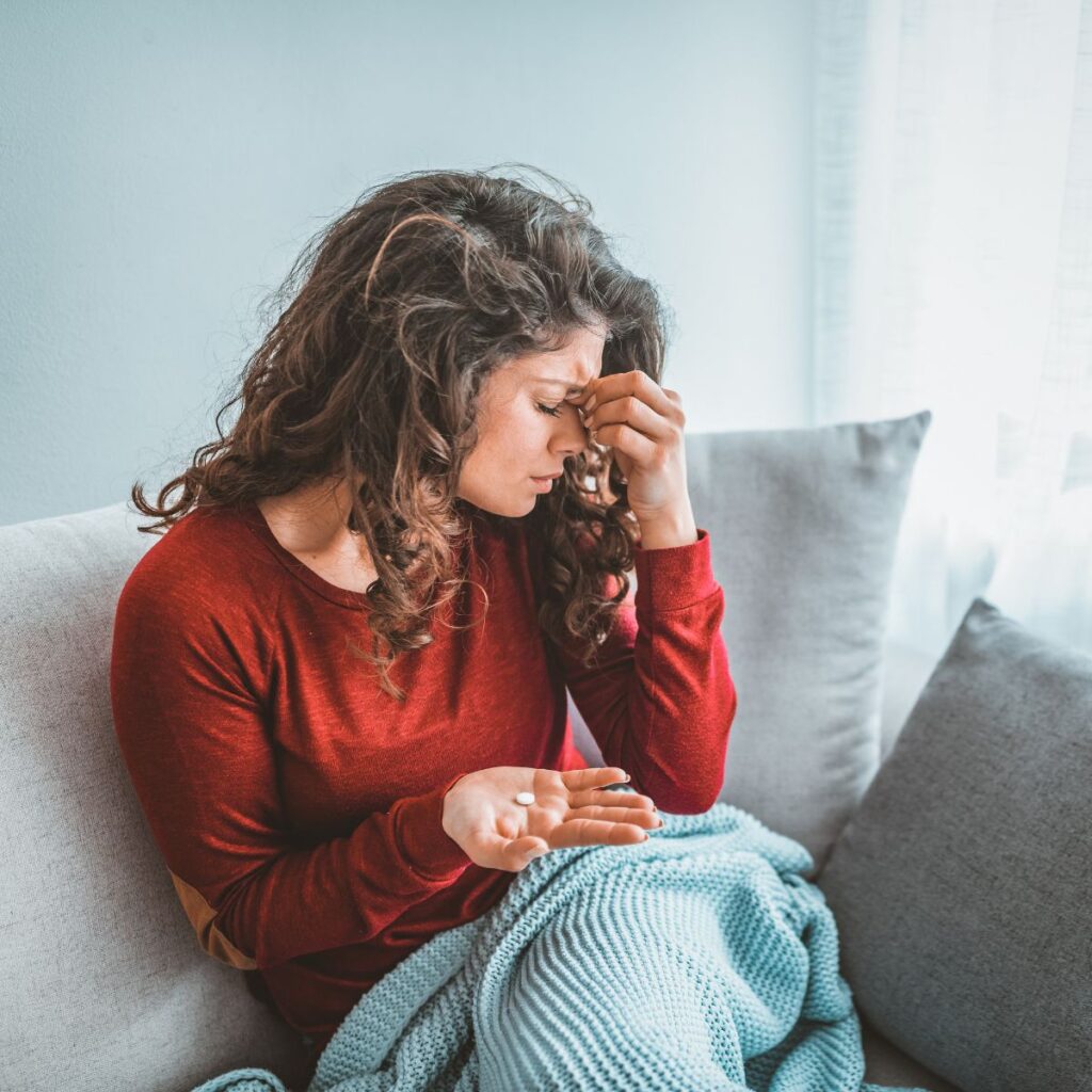 woman suffering from migraines and headaches